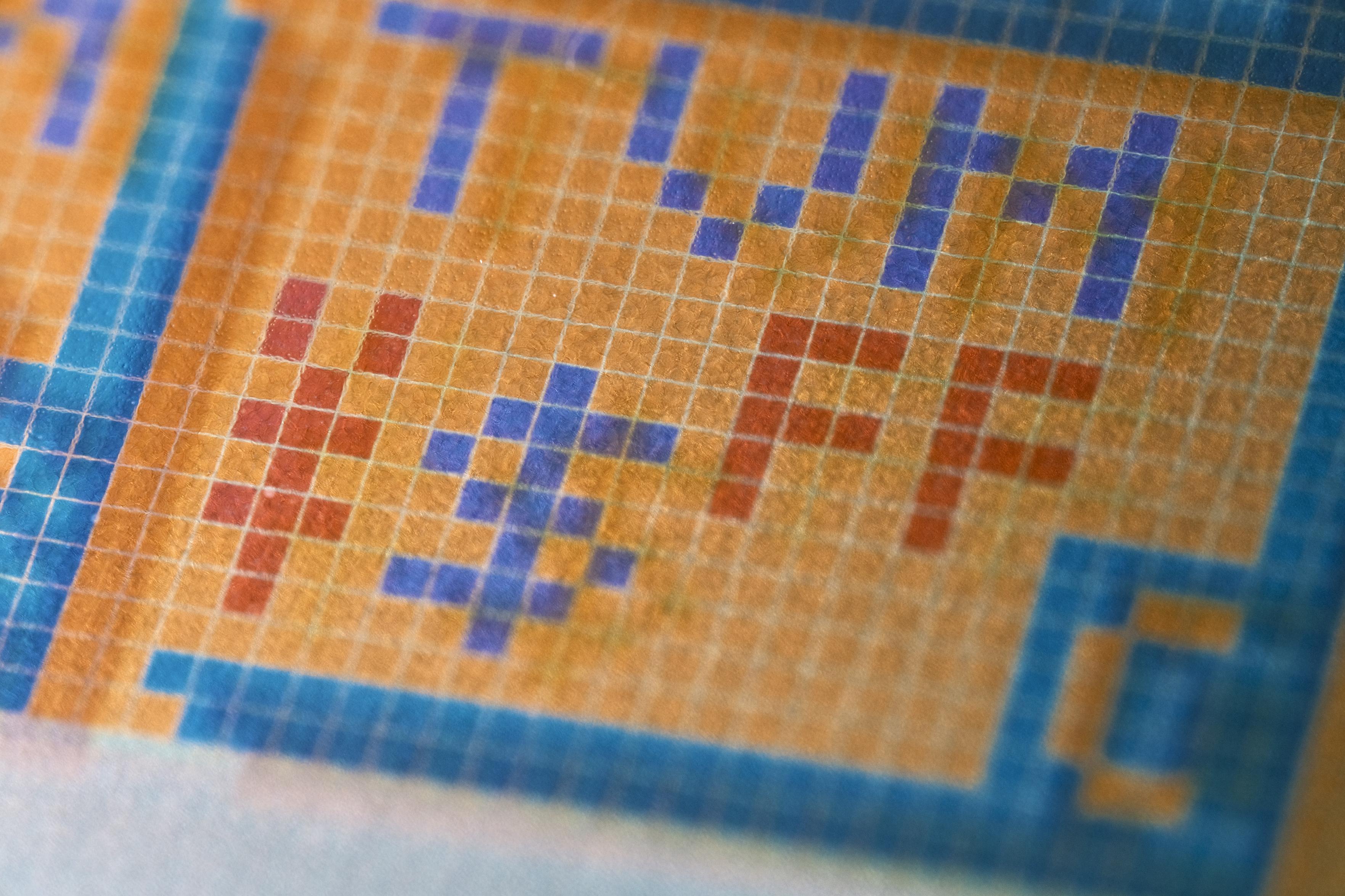 A closeup of a logo titled TVM, beneath it there’s a ¥ and $ sign as well as “FF” in red